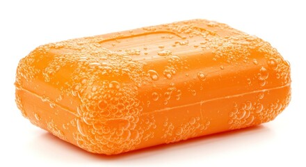 Close-up of an orange bar of soap, wet and textured.