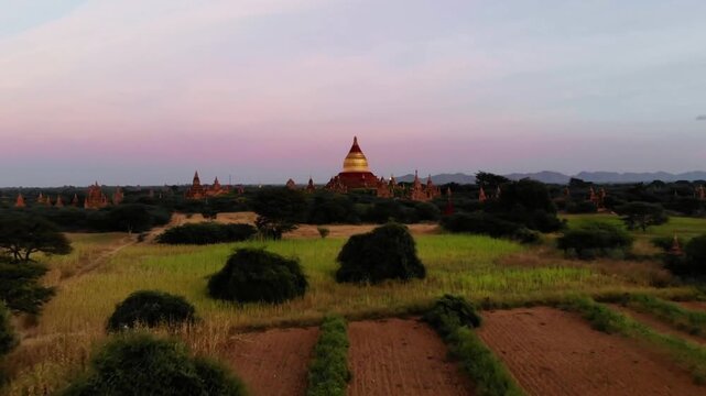 Golden light bathes the ancient temples of bagan at dusk, myanmar