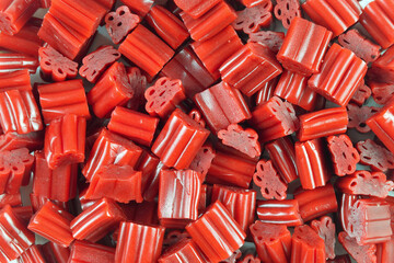 Delicious red licorice bites candy background