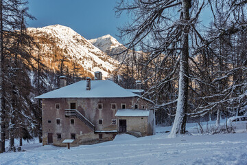 France - Peisey-Nancroix - Mine Palace - Snow-covered historical building at dusk