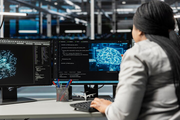System administrator inspecting neural network data center used for machine learning. Woman at work doing maintenance on server farm to optimize it for artificial intelligence workloads