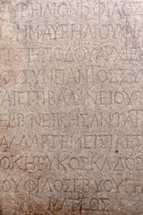 Obraz premium Turkey - Ephesus - Ancient Greek Inscription - Honorary Greek inscription for Proconsul Stephanos, carved into stone in Ephesus, recognizing civic or imperial service in antiquity.