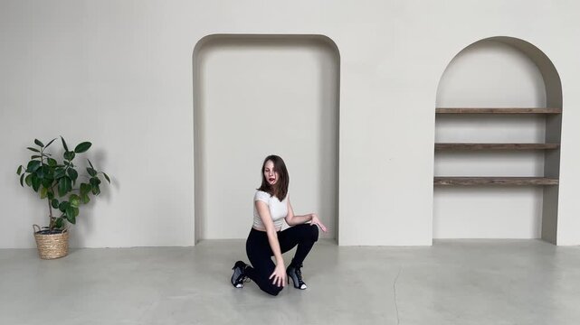 Elegant Woman Dancing in High Heels in Bright Studio