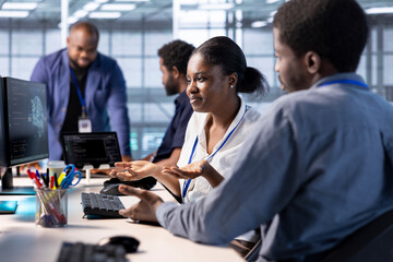 Data center admin shrugging shoulders, lacking sufficient knowledge to properly construct algorithms and build applications. Clueless server hub worker failing to debug and optimize code