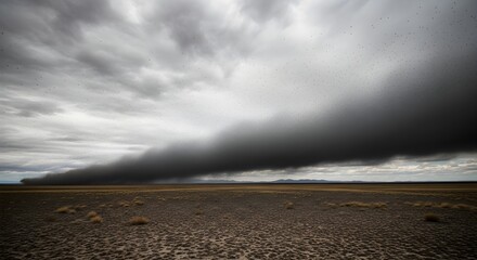 Powerful Dust Storm Engulfs Arid Desert Landscape Under Ominous Gray Sky, Highlighting Environmental