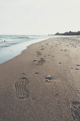 Footprints On A Sandy Beach