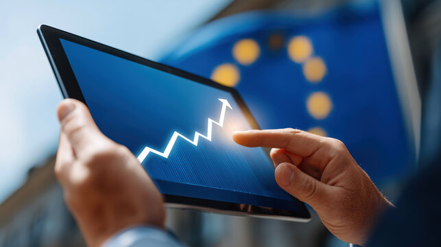 Hands using tablet with upward financial graph against European Union flag, representing growth and progress in the EU economy