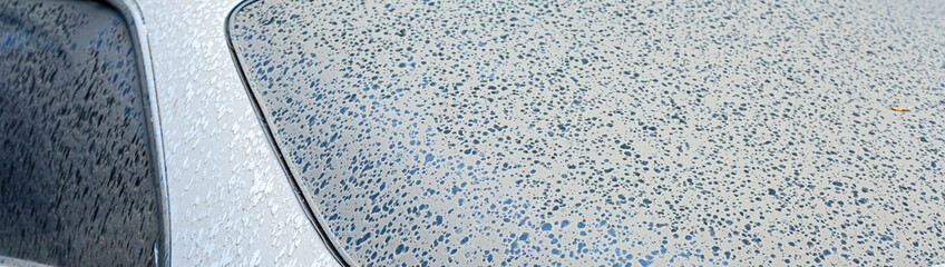 The first drops of water reach the surface of a dirty car requiring washing and cleaning, leading to corrosion and vehicle diagnostics at a service center