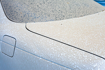 The first drops of water reach the surface of a dirty car requiring washing and cleaning, leading to corrosion and vehicle diagnostics at a service center