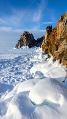 Frozen shoreline with rocky cliffs