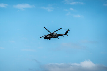 Military helicopter UH-60 in flight