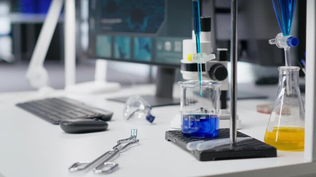 High tech chemistry lab equipment and computer in empty research facility, showcasing bioscience and pharmacology tools. Scientific environment highlights innovation in genetics and diagnostics.