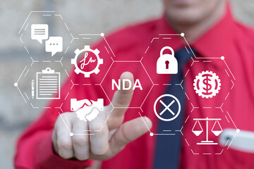 NDA Non disclosure agreement contract concept. Business person using virtual touch screen push abbreviation: NDA. Legal acknowledge signing of confidential NDA document.