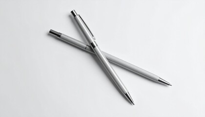 Elegant Silver Pens Arranged on a White Background