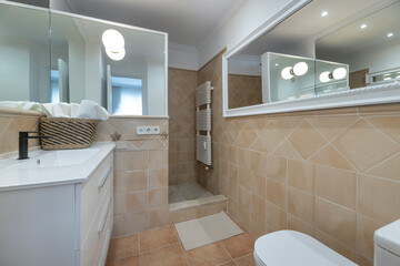 Bathroom with a walk-in shower without a screen, non-slip epoxy resin flooring, and underfloor heating