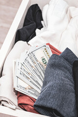 a stash of cash in a closet with underwear kept at home for emergencies