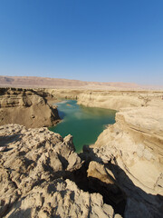 Secret river on the dead sea, view of a long and dry salt river stream in the northern part of the...