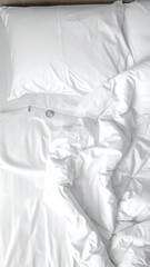 Crisp white bedding, slightly rumpled