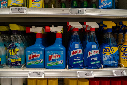 Close up of Windex Hertel Zep and Invisible Glass cleaners on store shelf. Toronto, Canada - September 24, 2025.
