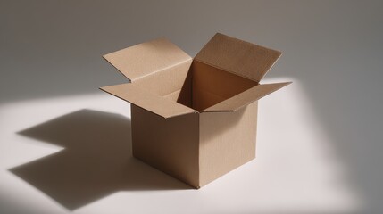 Open Cardboard Box Casting Dramatic Shadows on a Textured White Surface.