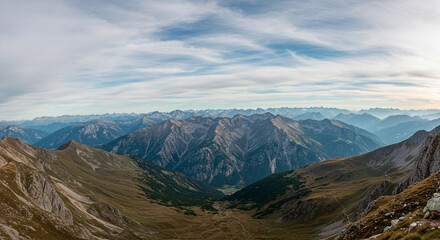 Fototapeta premium Panoramic View of the Alps Mountains and Deep Valley