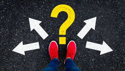 Conceptual image of confusion and options, person standing on arrows with question mark.