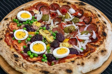 The most acclaimed, traditional and popular Brazilian pizza, half pepperoni calabresa and half Portuguese