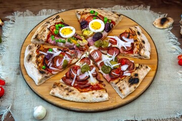 The most acclaimed, traditional and popular Brazilian pizza, half pepperoni calabresa and half Portuguese