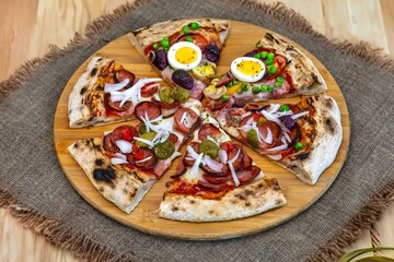 The most acclaimed, traditional and popular Brazilian pizza, half pepperoni calabresa and half Portuguese