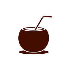 Brown coconut drink with straw sits on a white surface, simple and minimal, suggesting refreshment and tropical vibes.