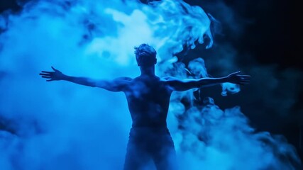 A silhouetted figure emerges from blue smoke, creating a dramatic atmosphere.