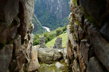 Stone walls and scenic valley view at Machu Picchu, Peru