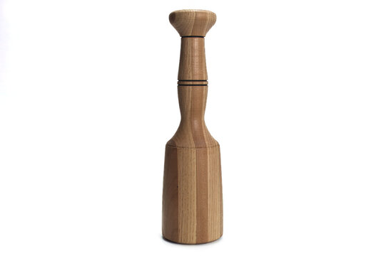 A hand lathe turned wood mallet on a white background. The mallet is a good representation of artisan quality woodworking. The mallet is centered.