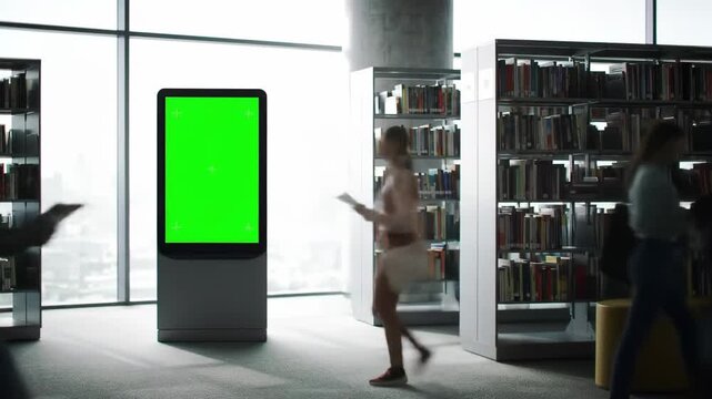 Timelapse of People in Library with Green Screen Display