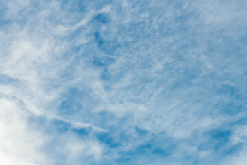 High cloud in the blue afternoon sky