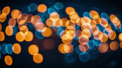 Orange and blue bokeh lights on dark background abstract