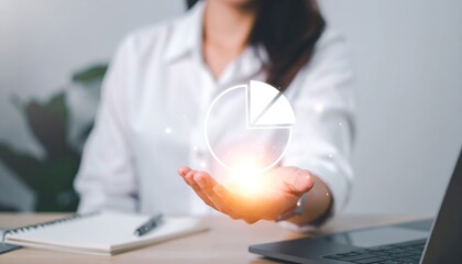 Businesswoman presenting a glowing holographic pie chart in a contemporary workplace