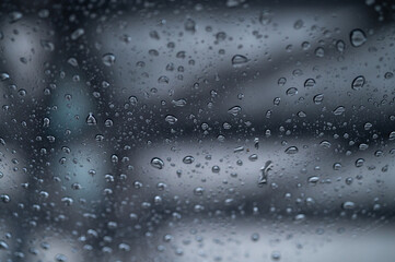 Obraz premium Dew drop on the car glass window during raining. Dew is the moisture that forms as a result of condensation.