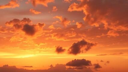 Obraz premium A breathtaking sunset sky panorama with vibrant warm hues and glowing clouds.