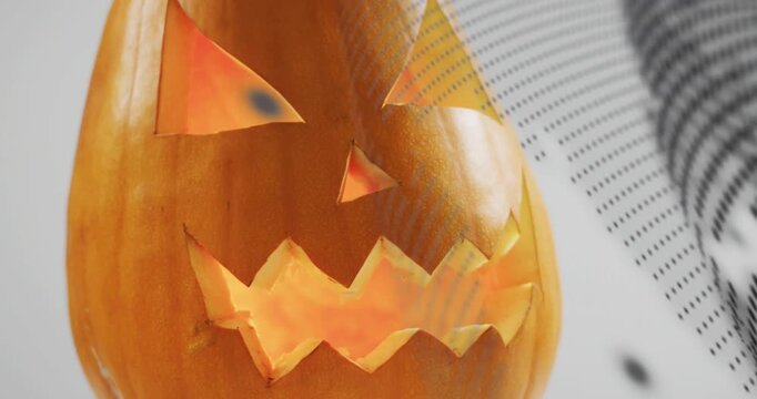 Halftone dots appearing at right edge sweeping carved pumpkin face then receding revealing glow