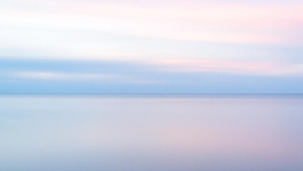 Obraz premium Soft pastel horizon with gentle clouds over a calm sea