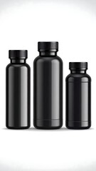Three black glossy bottles of varying heights, arranged in size order against a white background