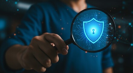 Focus on Security: Magnifying glass examines digital shield symbol, emphasizing data protection and privacy in a technological context.