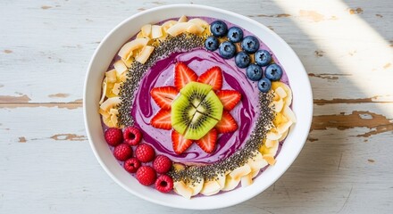 A purple smoothie bowl adorned with fruits nuts and seeds