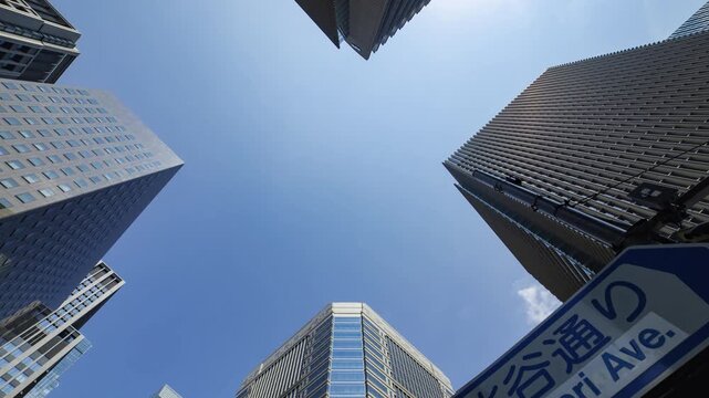 A timelapse of cloud reflecting the office building low angle view zoom