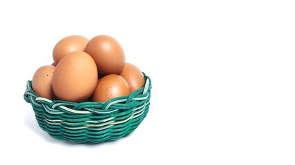 Side view Stack of fresh chicken egg in green basket wicker bamboo. Isolated on white background with copy space. Suitable for editing and used for food and nutrition advertising. Clipping path.