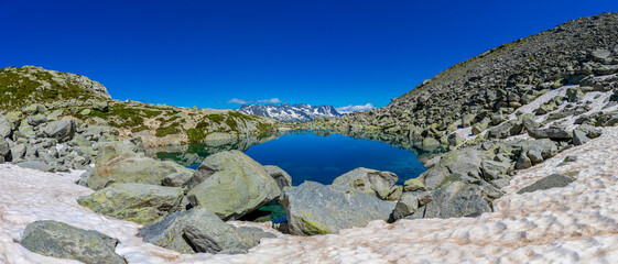Mountain landscape of the Alps in Chamonix valley, France high resolution wide angle panoramic landscape. Alpine scenery in summer sunny weather on Tour du Mont Blanc, TMB trekking route