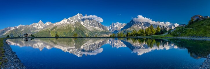 Mountain landscape of the Alps in Chamonix valley, France high resolution wide angle panoramic landscape. Alpine scenery in summer sunny weather on Tour du Mont Blanc, TMB trekking route
