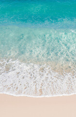 abstract sand beach from above with light blue transparent water wave and sun lights, summer vacation background, Deep blue sea texture, Sandy beach and sea waves top view. Generative ai