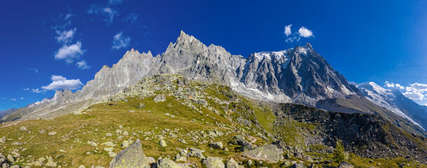 Mountain landscape of the Alps in Chamonix valley, France high resolution wide angle panoramic landscape. Alpine scenery in summer sunny weather on Tour du Mont Blanc, TMB trekking route